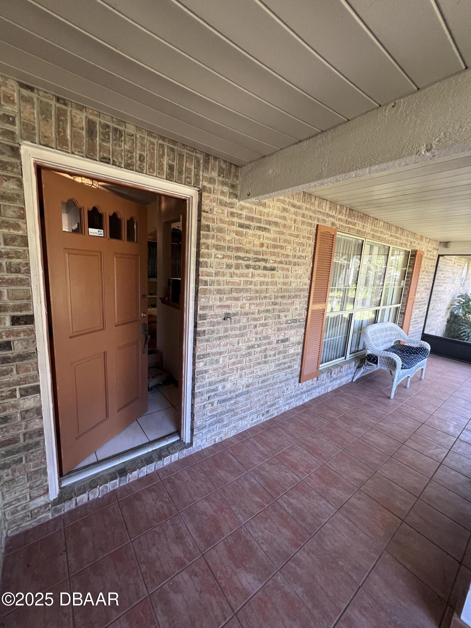 2550 Lake Ruby Road DeLand, FL 32724 - Photo 7 of 20 a view of empty room with wooden floor and fan