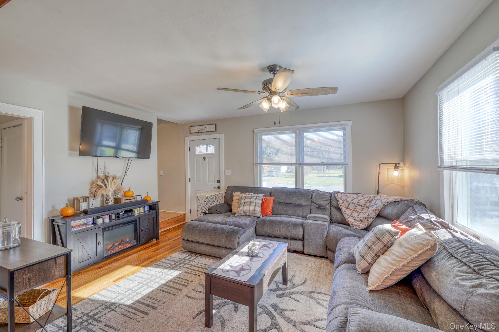 143 Plains Road Walden, NY 12586 - Photo 11 of 36 Living room featuring wood finished floors and ceiling fan