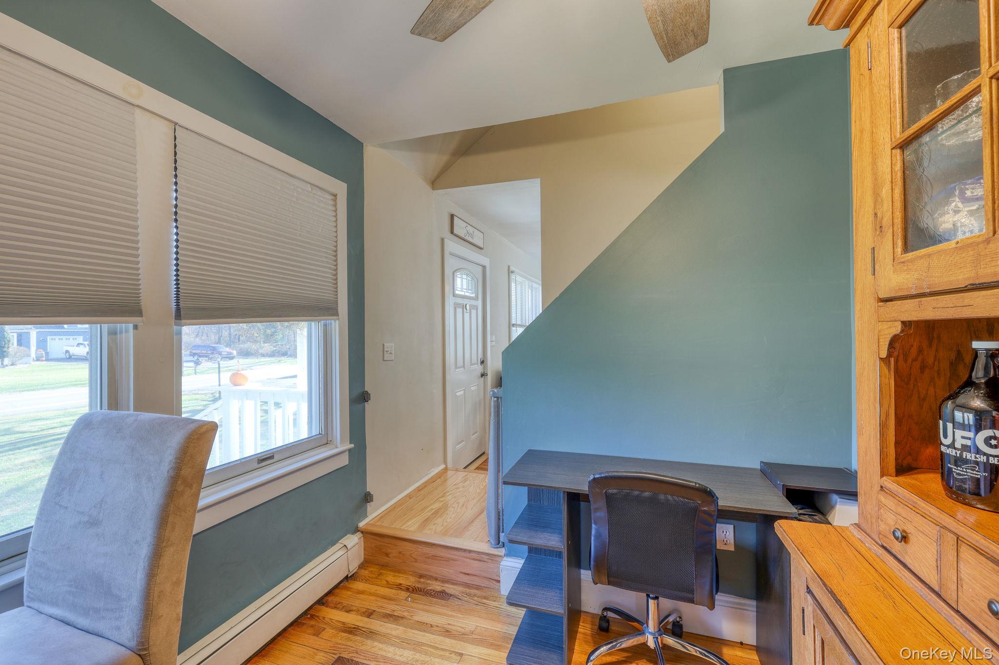 143 Plains Road Walden, NY 12586 - Photo 18 of 36 Office featuring a baseboard radiator, light wood finished floors, and a ceiling fan