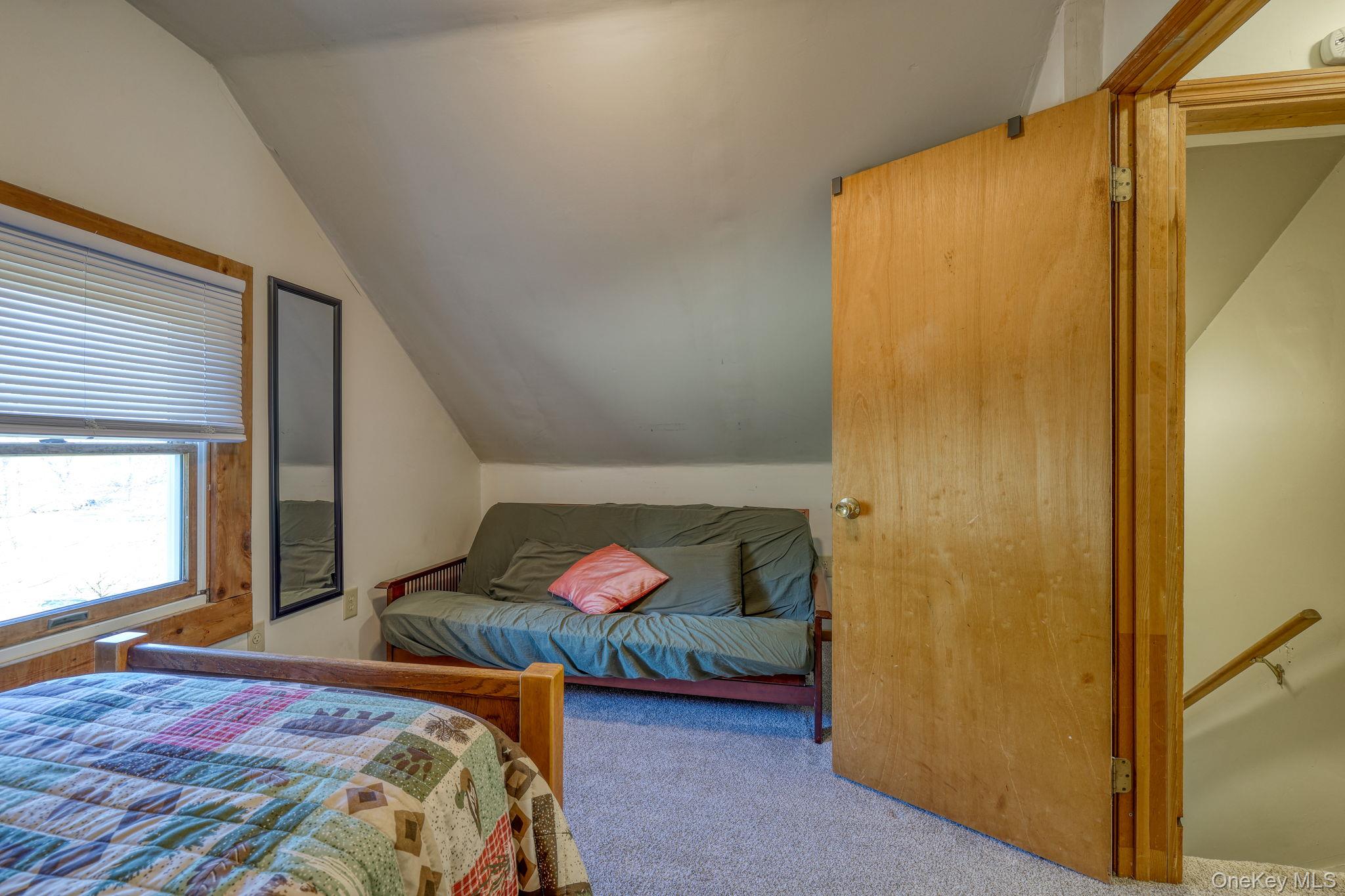 143 Plains Road Walden, NY 12586 - Photo 19 of 36 Bedroom with vaulted ceiling and carpet