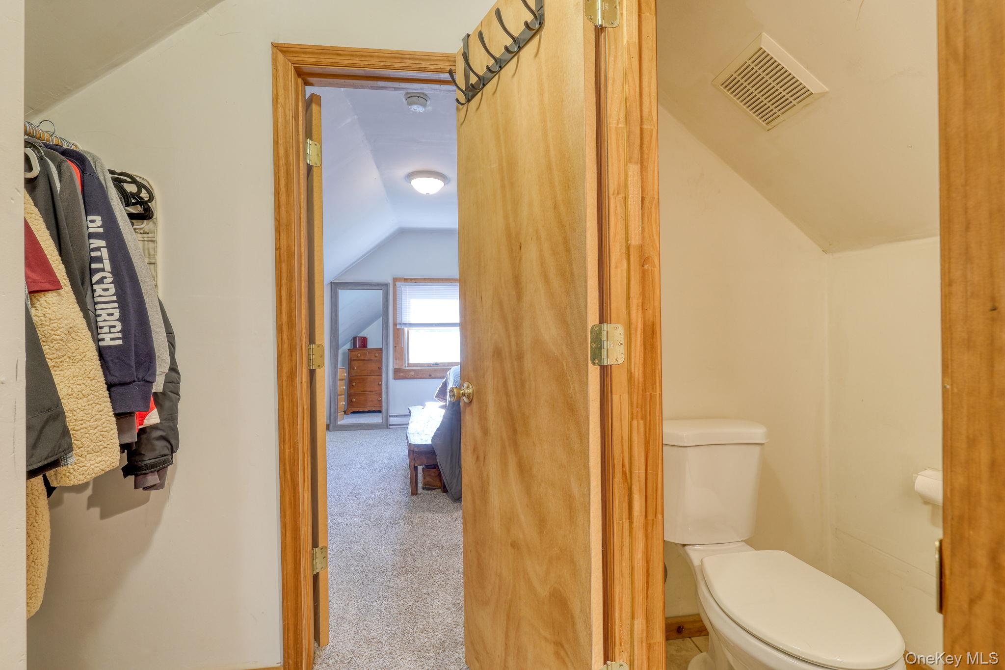 143 Plains Road Walden, NY 12586 - Photo 23 of 36 1/2 Bathroom featuring lofted ceiling and carpet floors