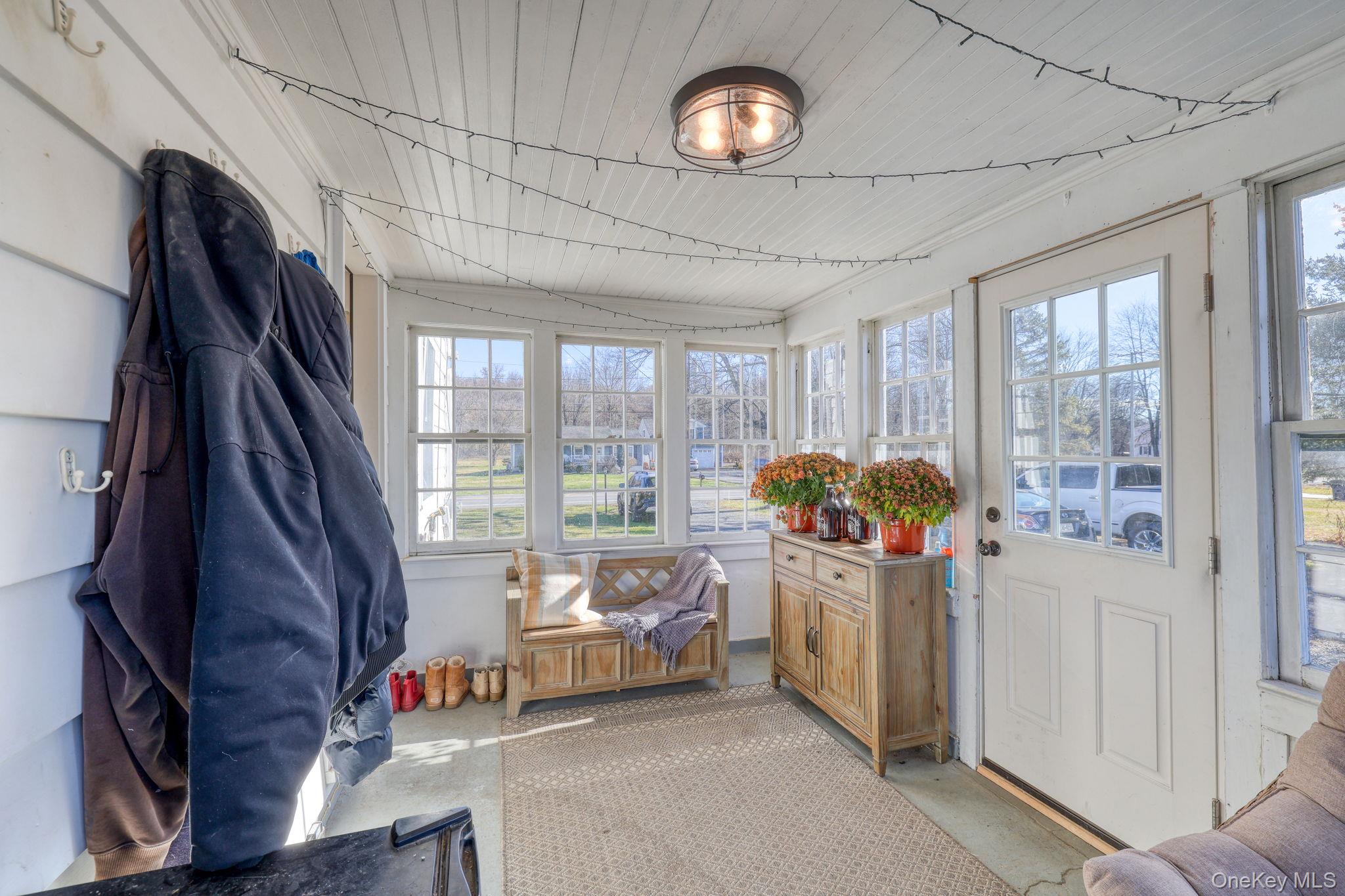 143 Plains Road Walden, NY 12586 - Photo 5 of 36 Sunroom / solarium featuring concrete floors, plenty of natural light, and wood ceiling