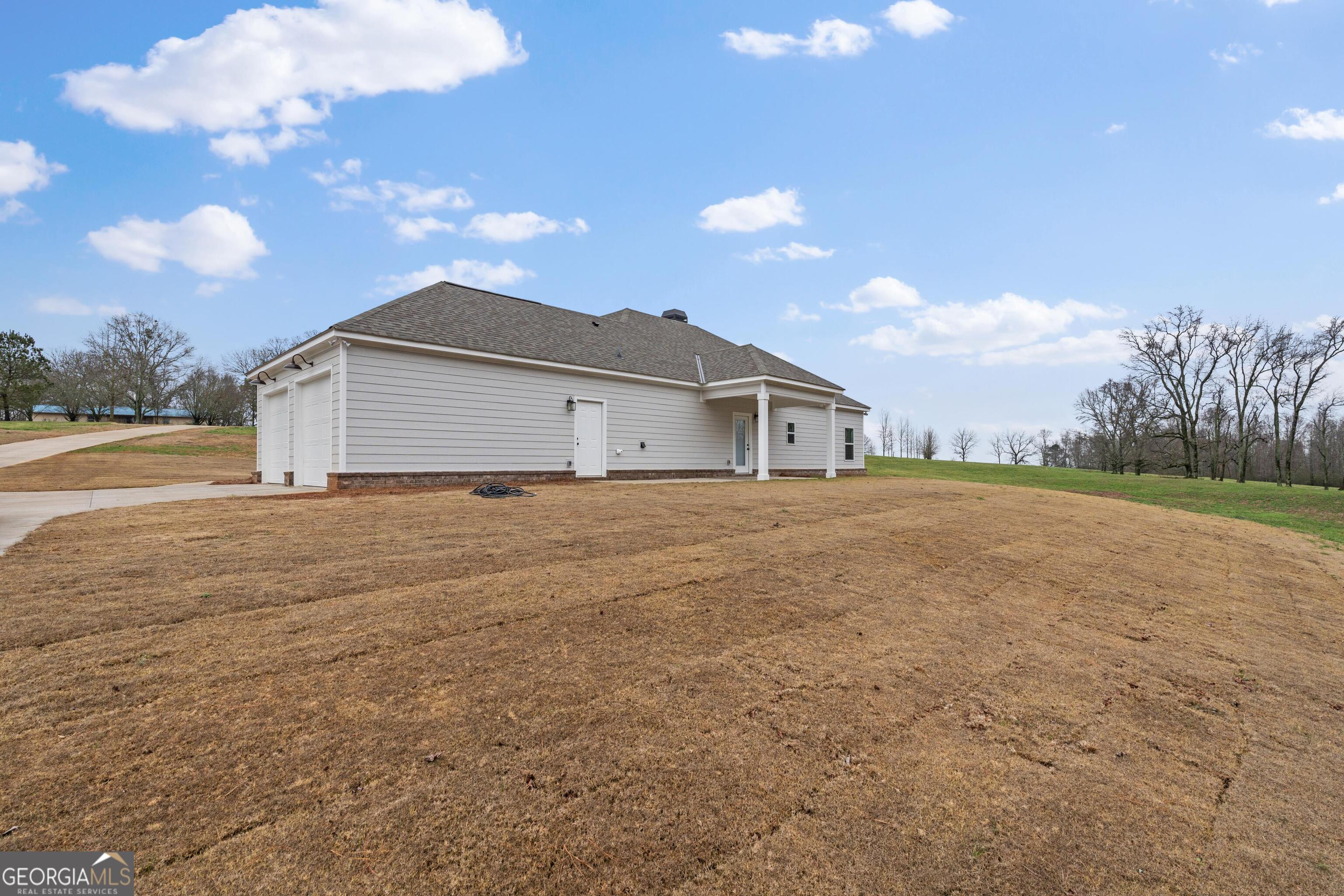 340 Happy Hollow Road Roopville, GA 30170 - Photo 17 of 22 a view of a house with a yard
