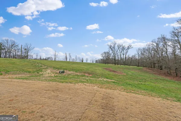 a view of a lake with a yard