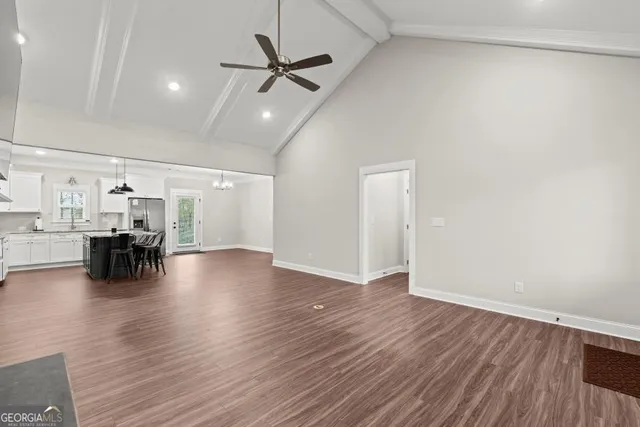 a view of livingroom with hardwood floor and a ceiling fan