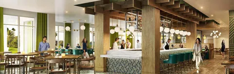 a view of a hallway with a dining table and chairs