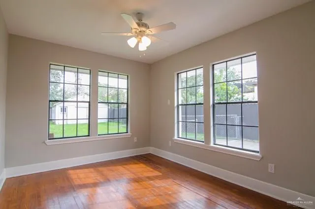 a view of an empty room with a window