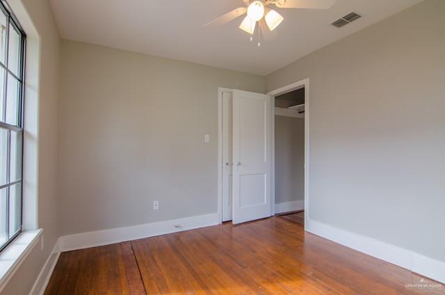 1112 North 16th Street McAllen, TX 78501 - Photo 14 of 21 an empty room with wooden floor and windows