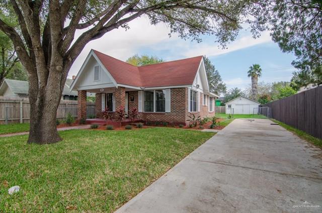 1112 North 16th Street McAllen, TX 78501 - Photo 17 of 21 a view of a house with a yard and tree s