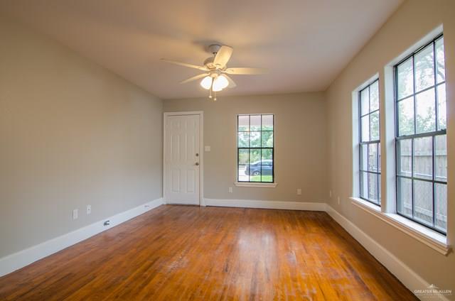 1112 North 16th Street McAllen, TX 78501 - Photo 4 of 21 wooden floor in an empty room with a window