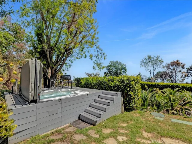 a view of a pathway with a wrought fence