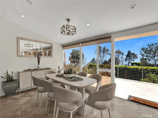 a very nice looking room with a large window and furniture