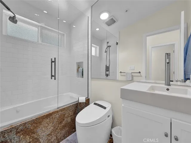 a living room with wooden floor and a window