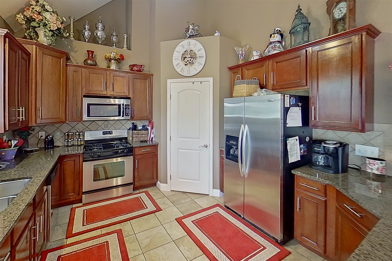 20 Fedor Circle Bloomington, IL 61705 - Photo 14 of 51 a kitchen with stainless steel appliances granite countertop a refrigerator a stove and a sink with wooden floor