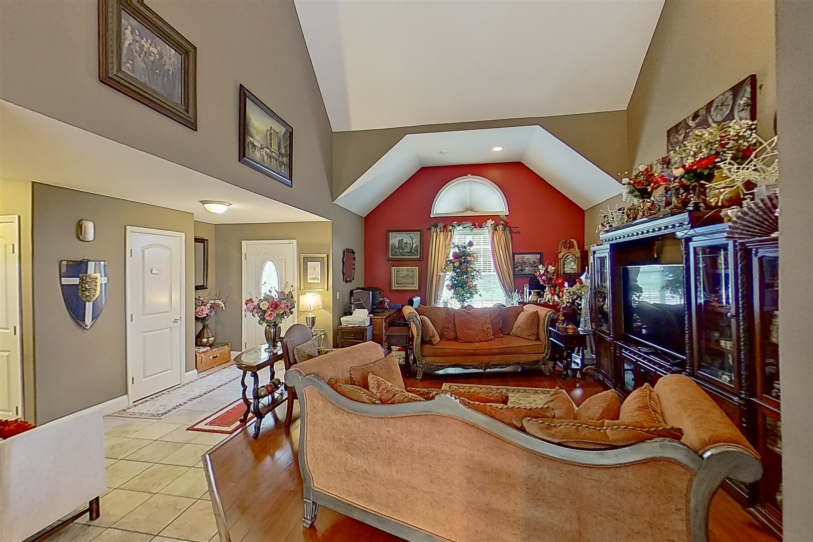 20 Fedor Circle Bloomington, IL 61705 - Photo 15 of 51 a living room with furniture a fireplace and a flat screen tv