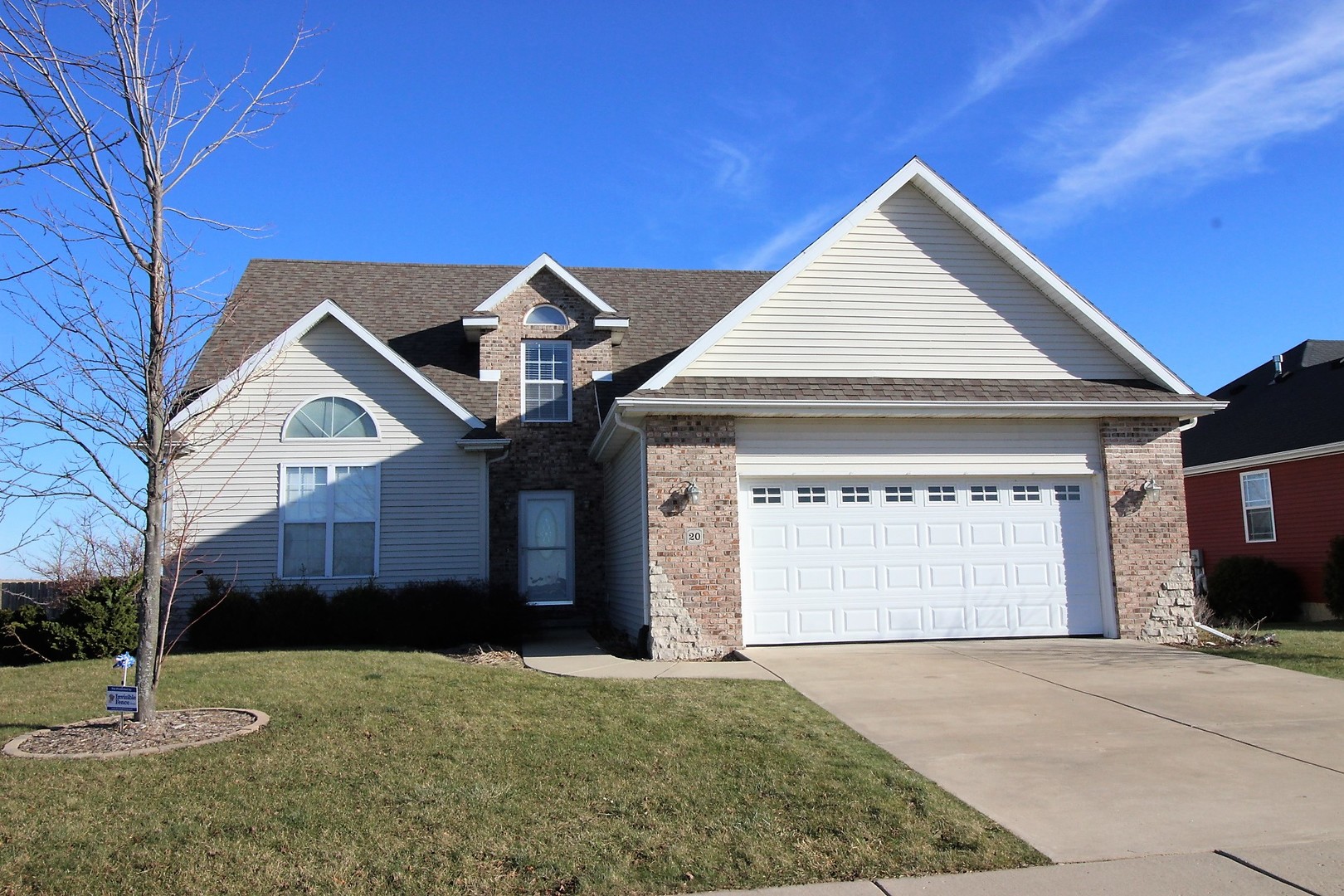 20 Fedor Circle Bloomington, IL 61705 - Photo 2 of 51 a front view of a house with a yard and garage