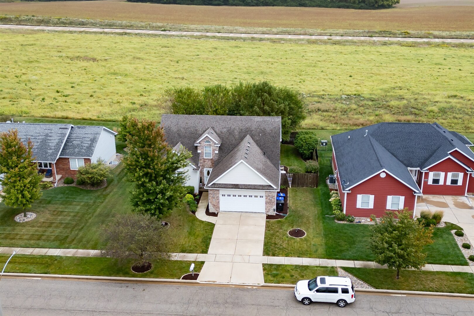 20 Fedor Circle Bloomington, IL 61705 - Photo 39 of 51 an aerial view of a house with a garden and lake view