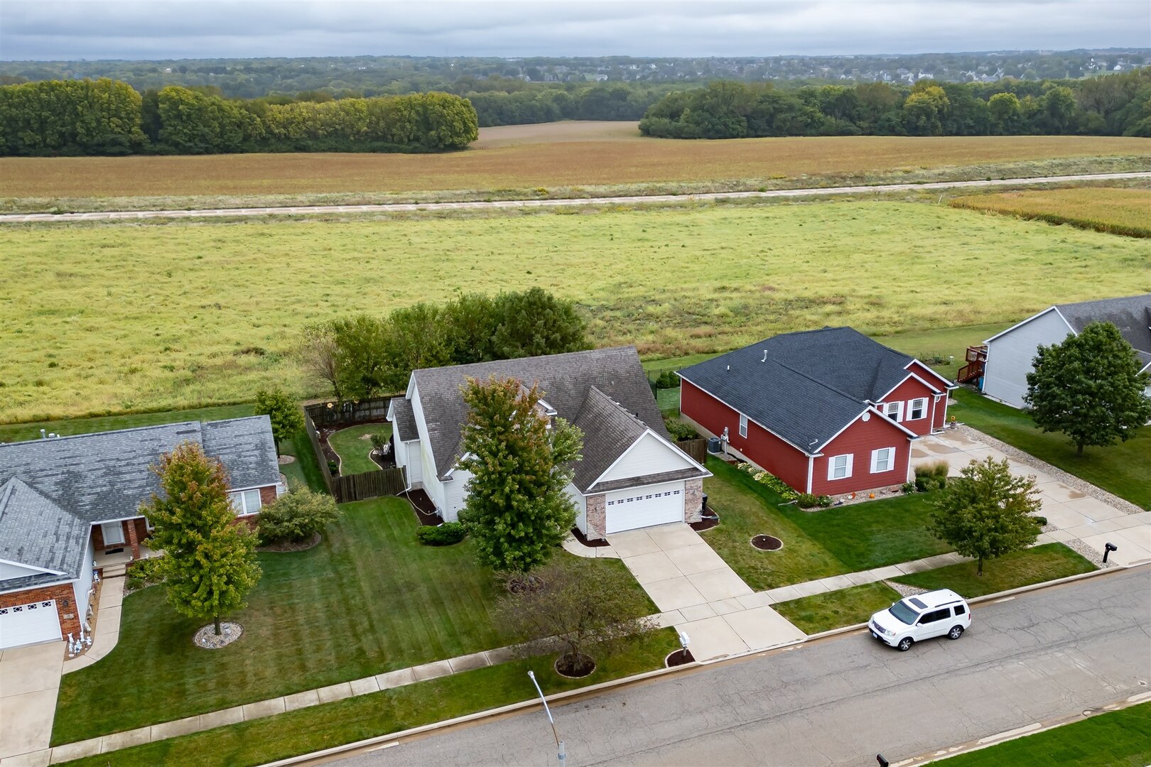 20 Fedor Circle Bloomington, IL 61705 - Photo 40 of 51 an aerial view of a house with a garden and lake view