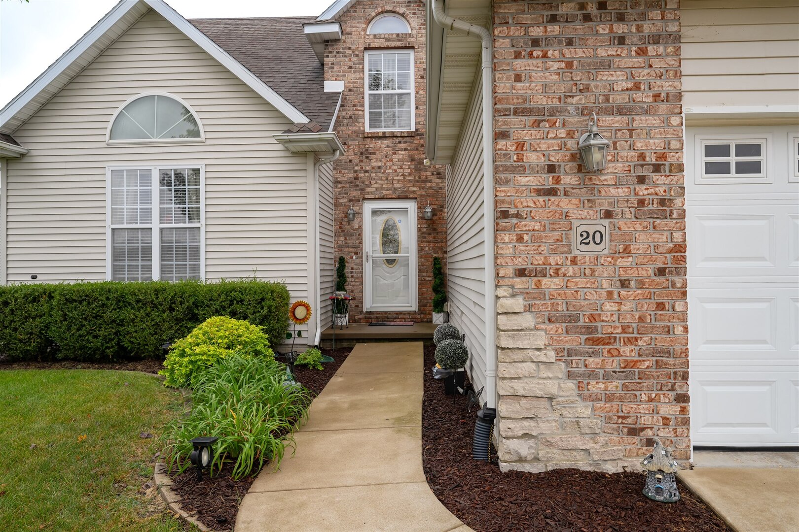 20 Fedor Circle Bloomington, IL 61705 - Photo 4 of 51 a view of a brick house with a yard