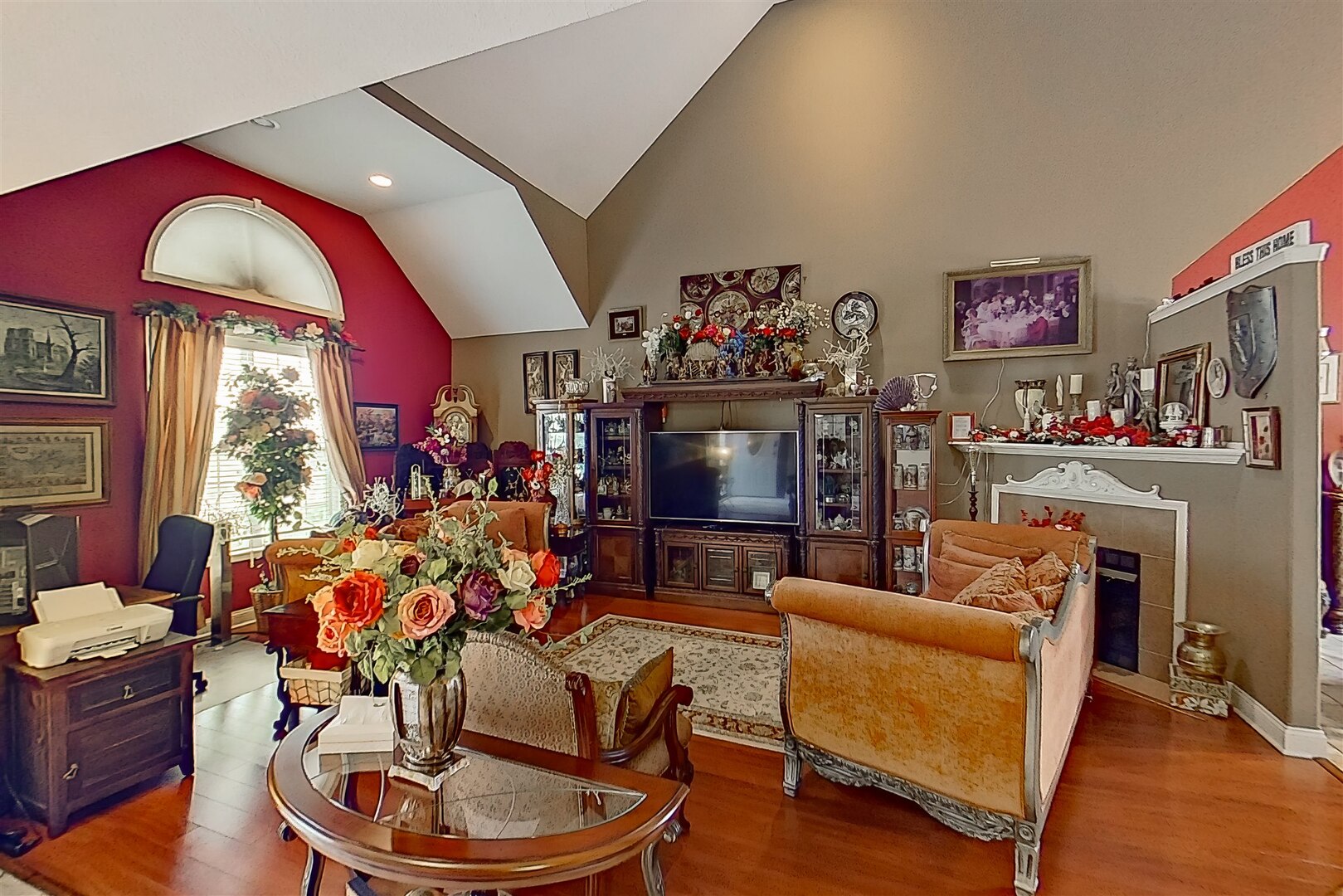 20 Fedor Circle Bloomington, IL 61705 - Photo 7 of 51 a living room with furniture a flat screen tv and a floor to ceiling window