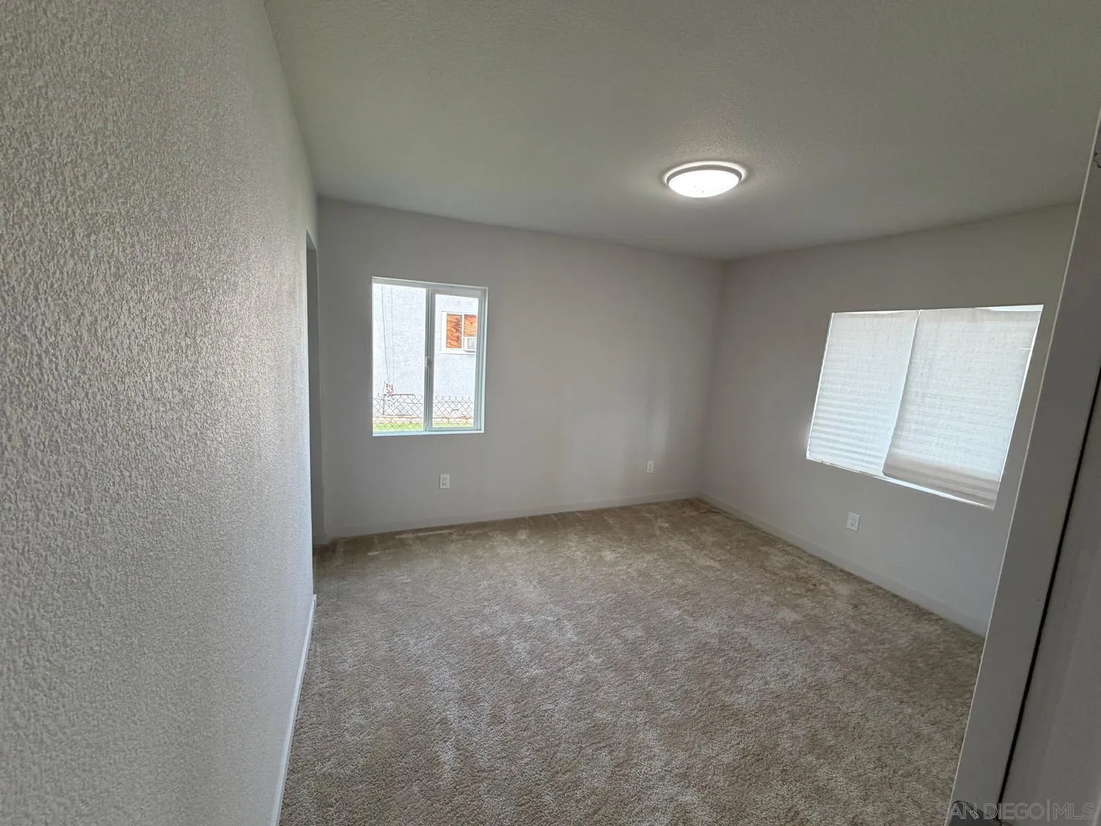 2959 Ridgeway Drive National City, CA 91950 - Photo 8 of 12 an empty room with windows