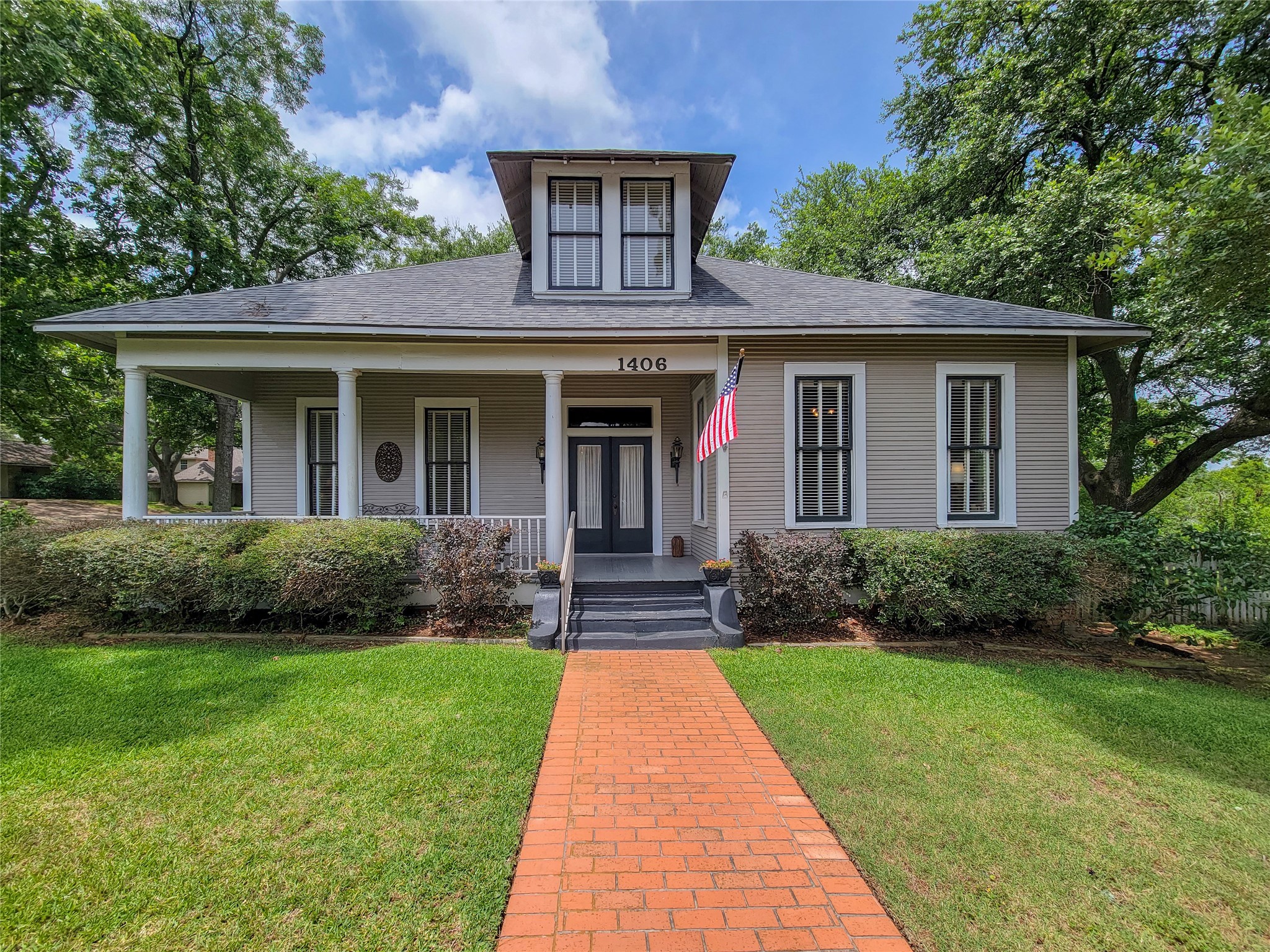 1406 Key Street Brenham, TX 77833 - Photo 2 of 50 This beautifully restored vintage home, built in 1886, features modern additions completed in 2010, blending timeless charm comfort and functionality.