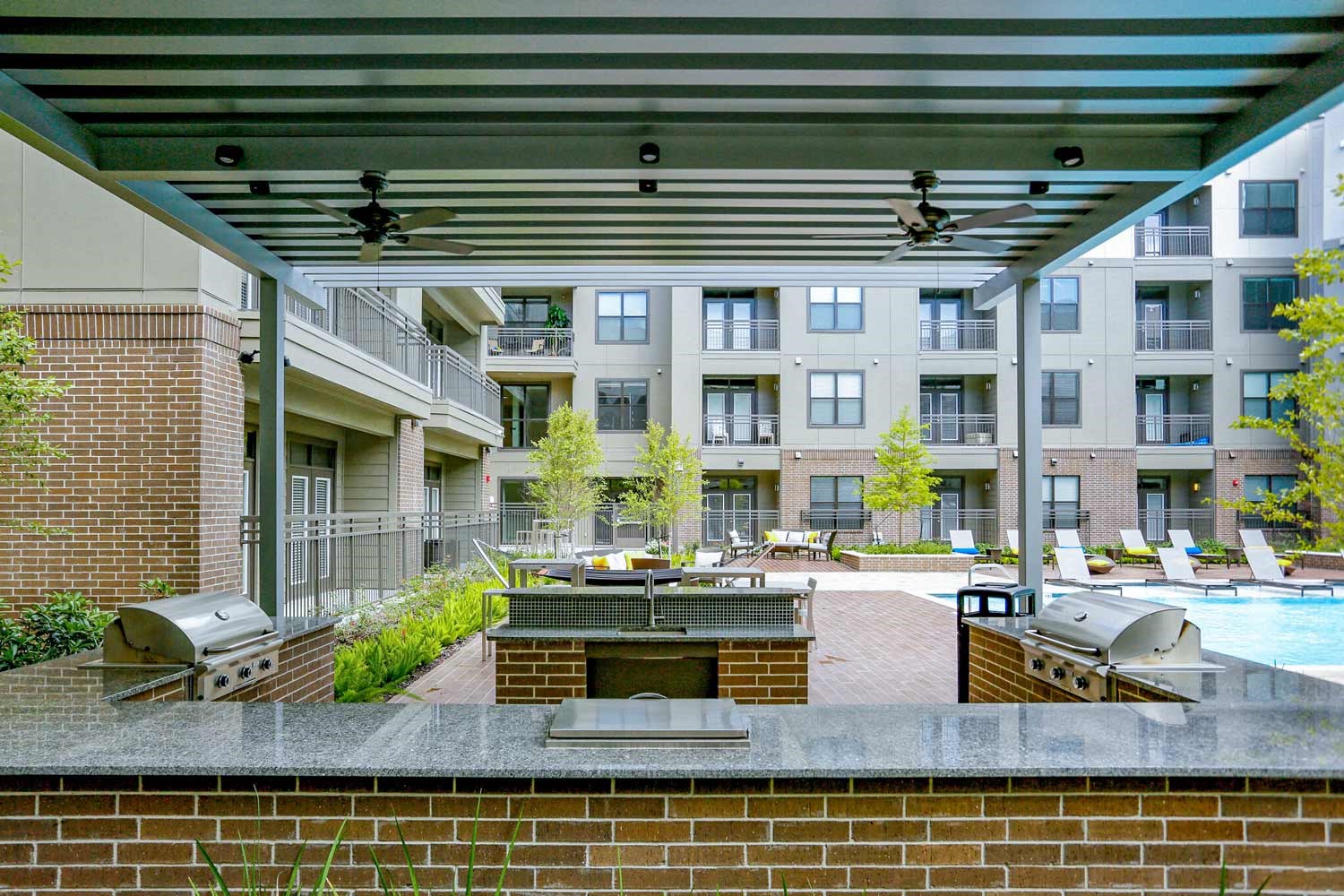 2033 South Gessner Road, Unit 3115 Houston, TX 77063 - Photo 13 of 22 a building outdoor space with lots of table and chairs