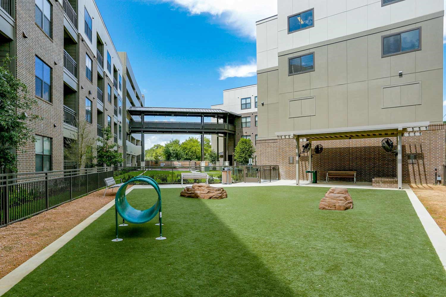 2033 South Gessner Road, Unit 3115 Houston, TX 77063 - Photo 15 of 22 a view of a chair and table in backyard of the house