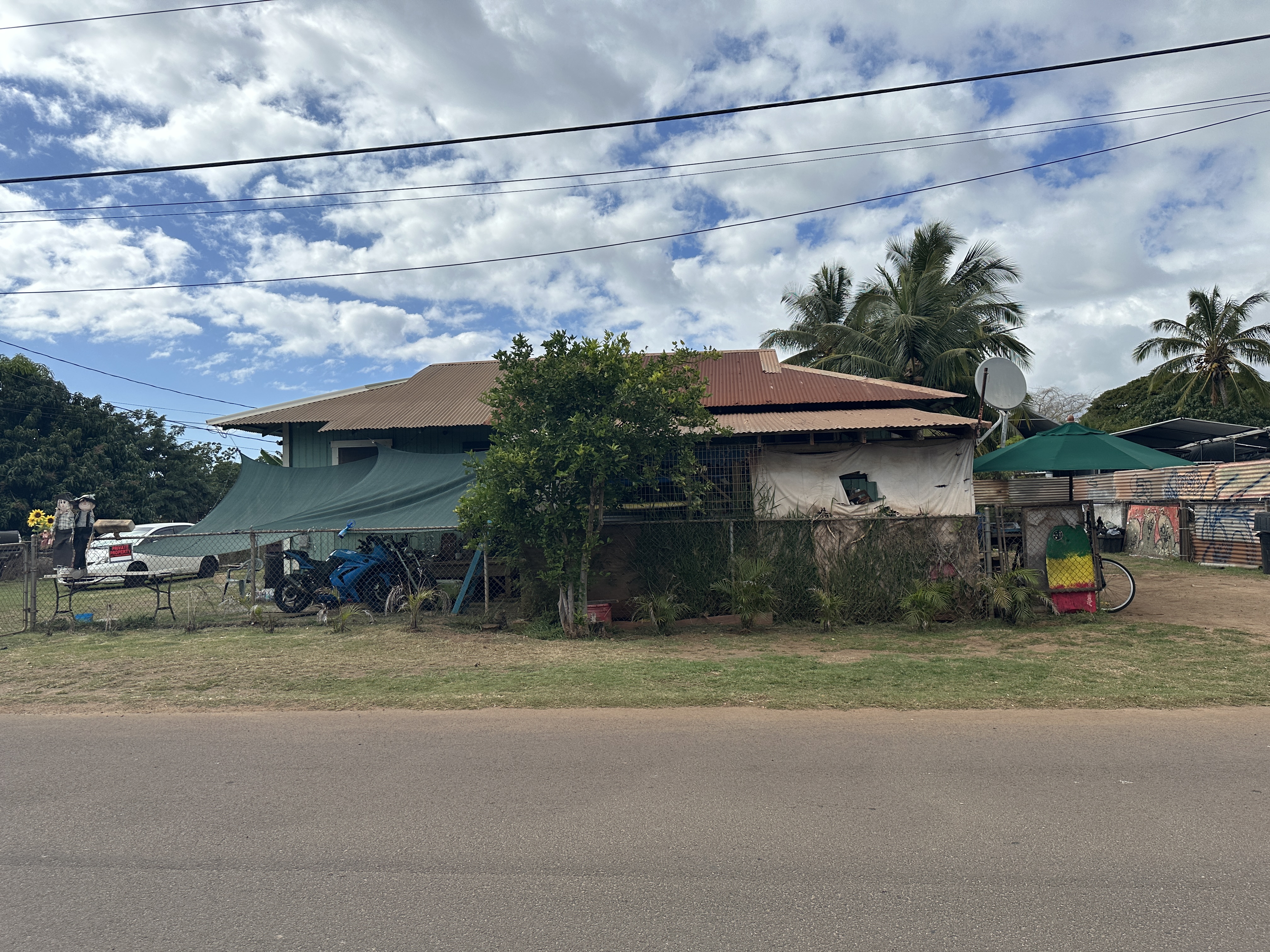 4587 Kala Road Kekaha, HI 96752 - Photo 1 of 19 a view of a car is parked in front of a building