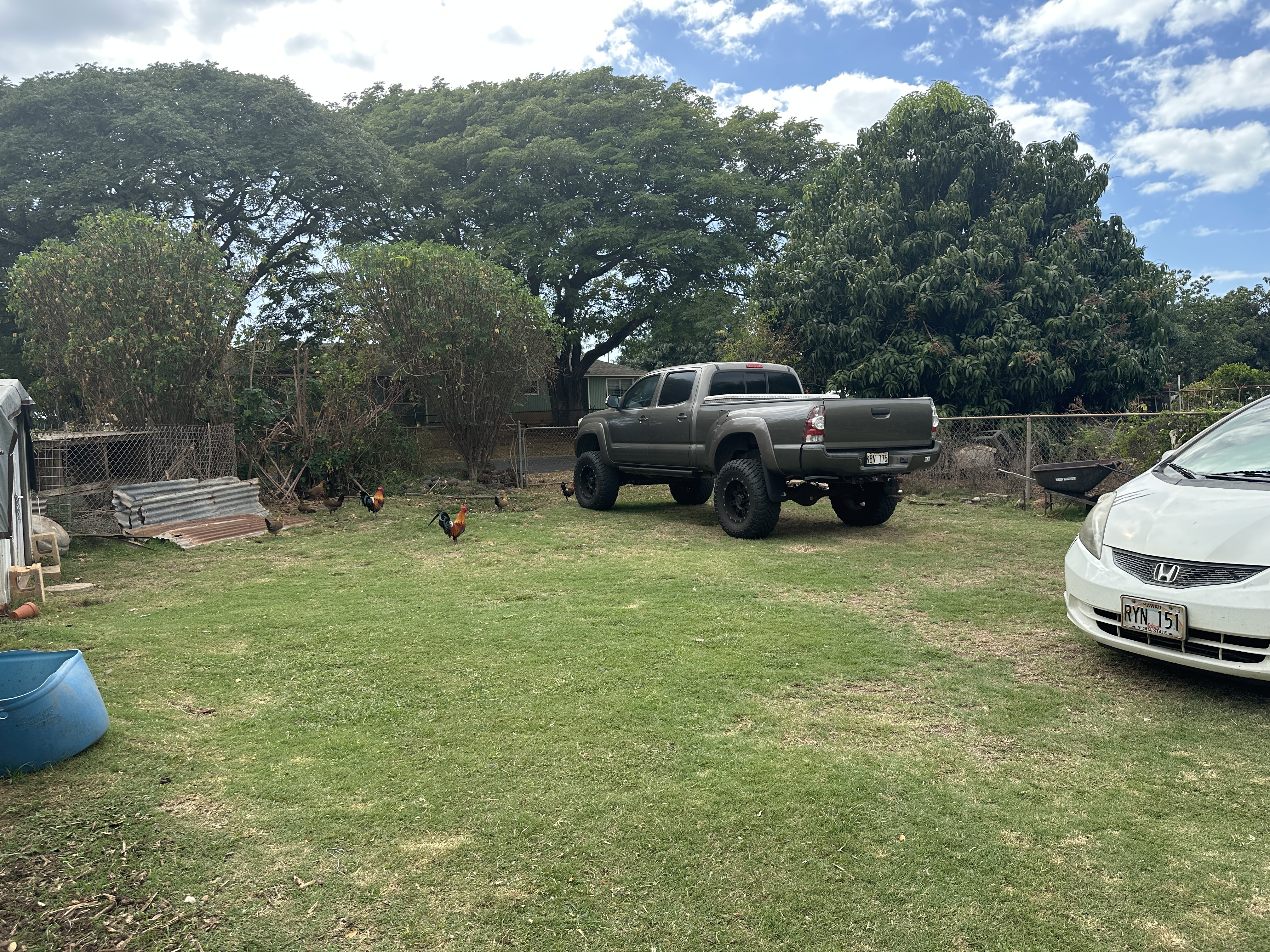4587 Kala Road Kekaha, HI 96752 - Photo 3 of 19 a view of a backyard with a car parked