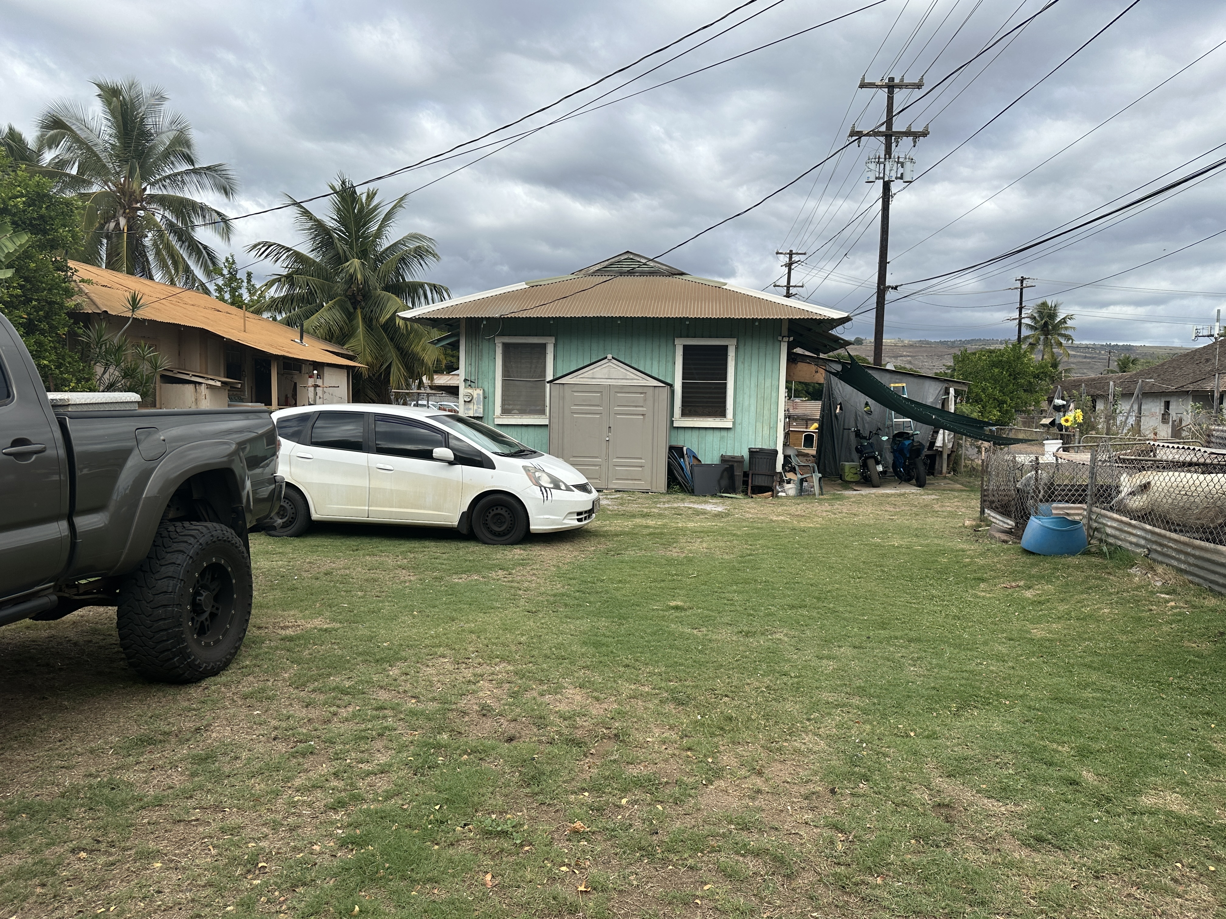 4587 Kala Road Kekaha, HI 96752 - Photo 4 of 19 a front view of a house with garden
