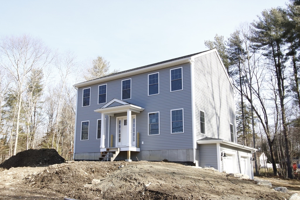 2989 Sharps Road Dighton, MA 02715 - Photo 1 of 19 a front view of a house with a yard