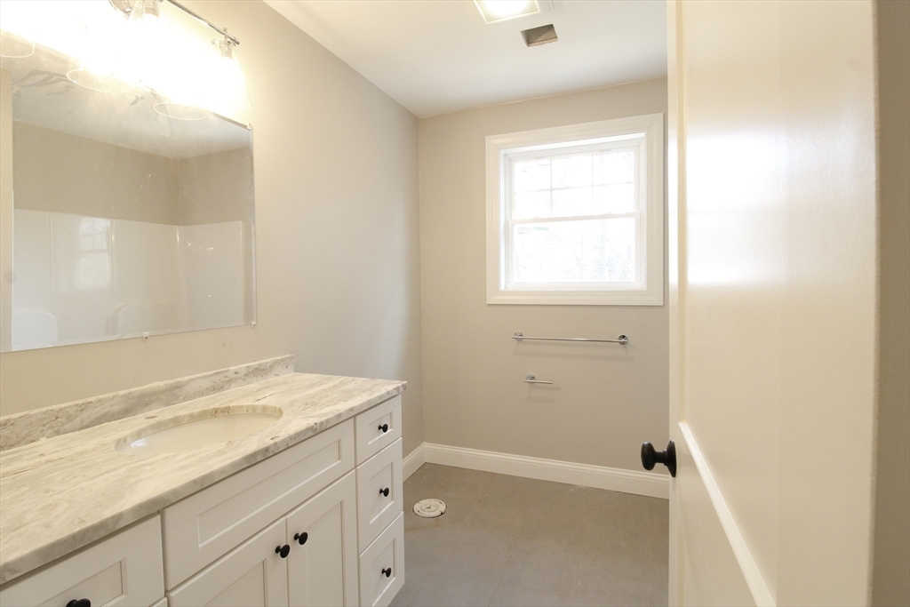 2989 Sharps Road Dighton, MA 02715 - Photo 15 of 19 a bathroom with a granite countertop sink a toilet and shower