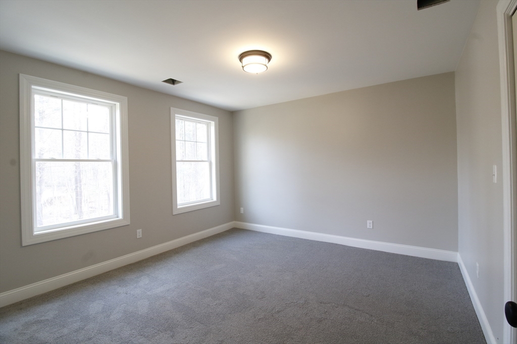 2989 Sharps Road Dighton, MA 02715 - Photo 16 of 19 an empty room with a window and doors