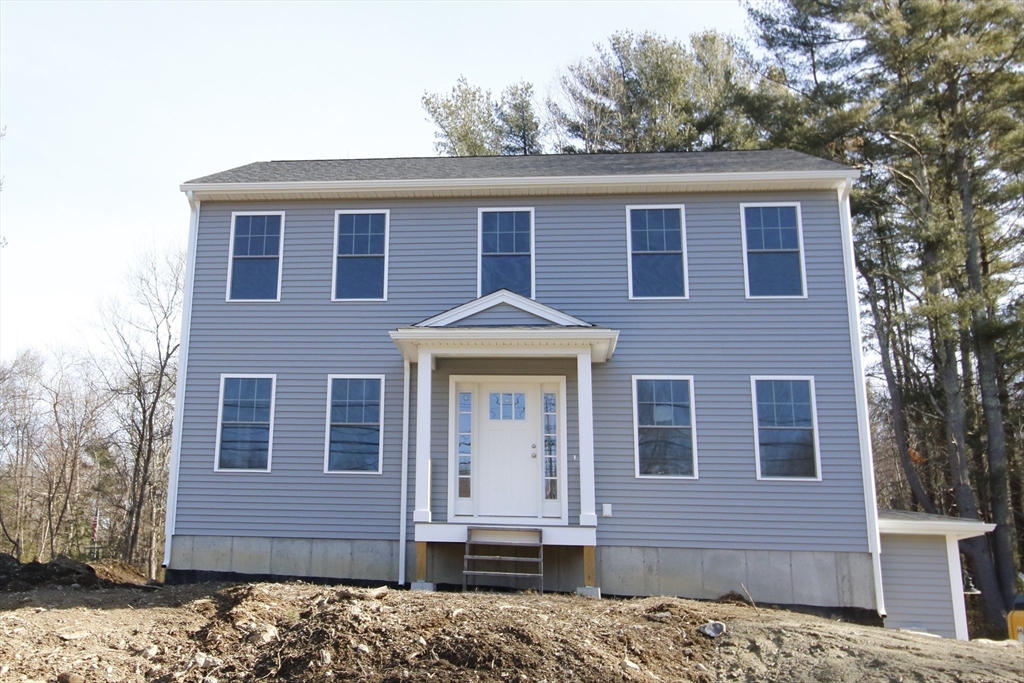 2989 Sharps Road Dighton, MA 02715 - Photo 2 of 19 a front view of a house with a yard