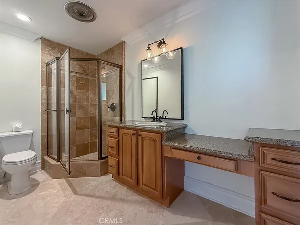 a bedroom with a bed and a glass door