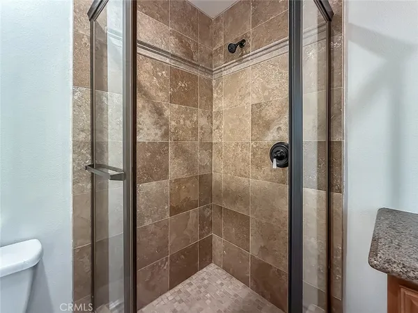 a bathroom with a sink vanity mirror and toilet