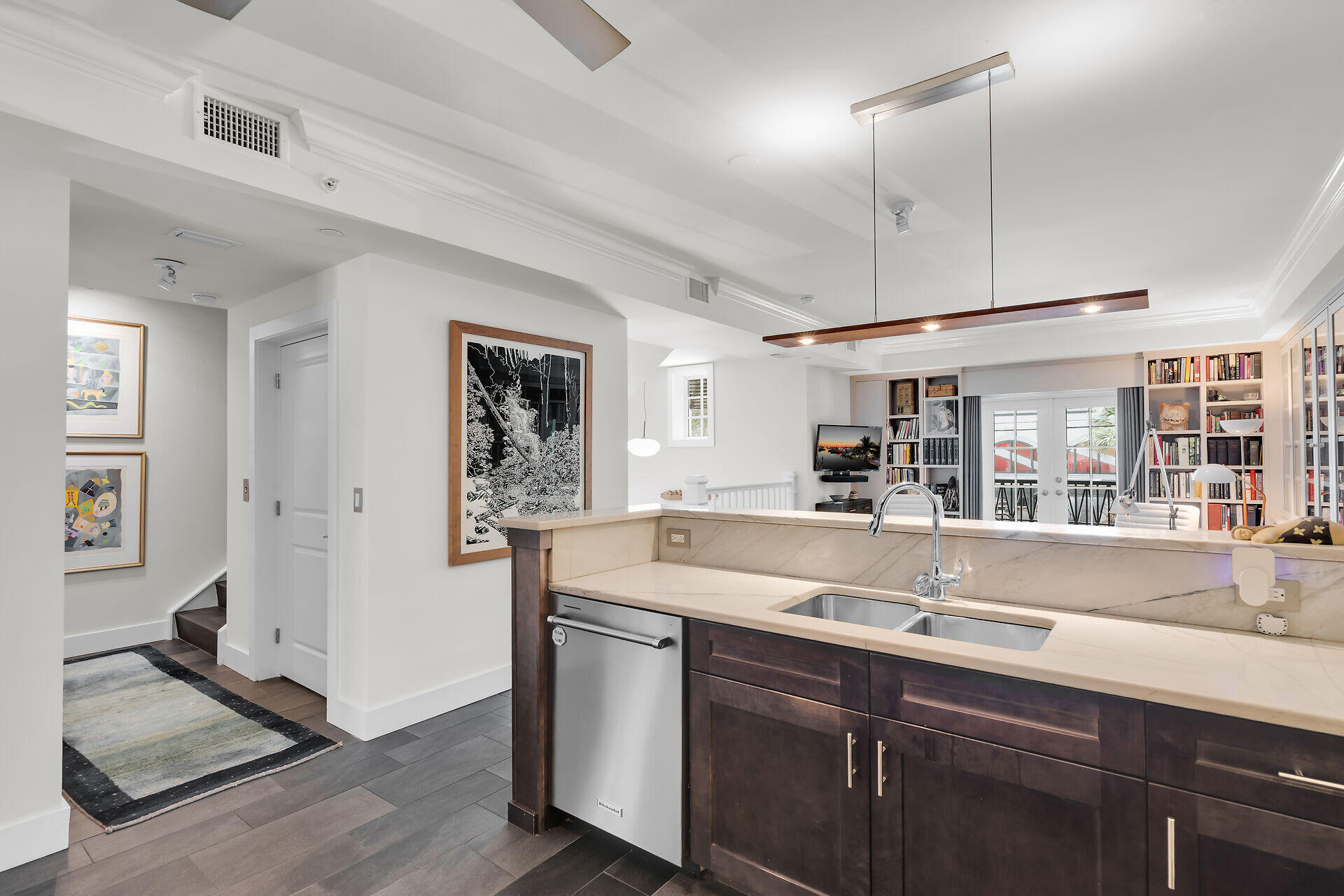 141 Simonton Street Key West, FL 33040 - Photo 14 of 49 a kitchen with stainless steel appliances granite countertop a sink and dishwasher with wooden floor