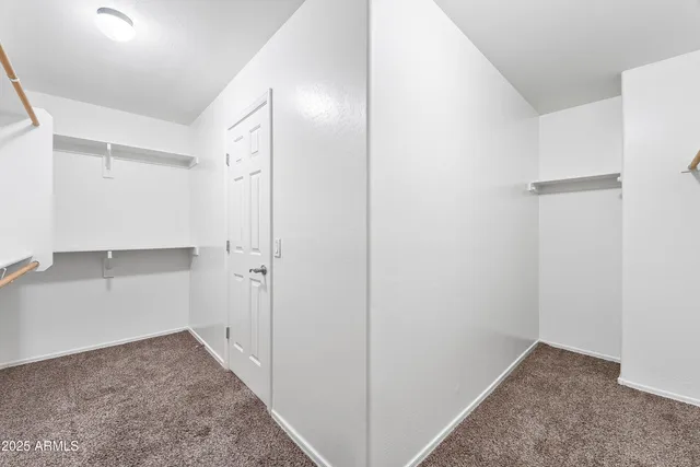 a bathroom with a sink vanity granite and toilet
