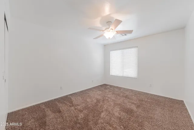 a bathroom with a toilet a sink a mirror and a bathtub