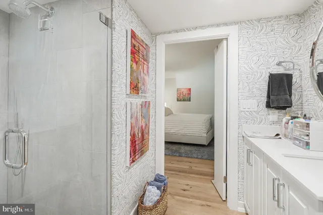 a en suite bathroom with a sink and a mirror