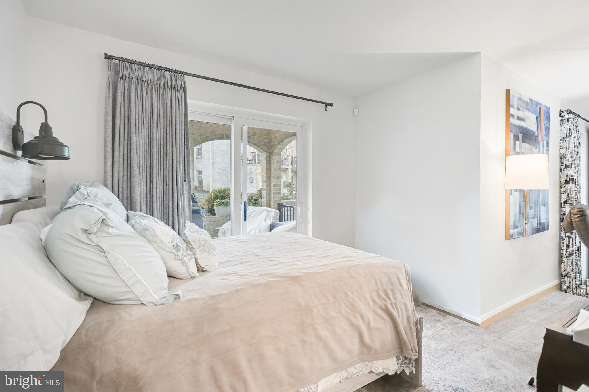 1000 Country Club Road, Unit A13 York, PA 17403 - Photo 15 of 23 a bedroom with a bed and a dresser with mirror