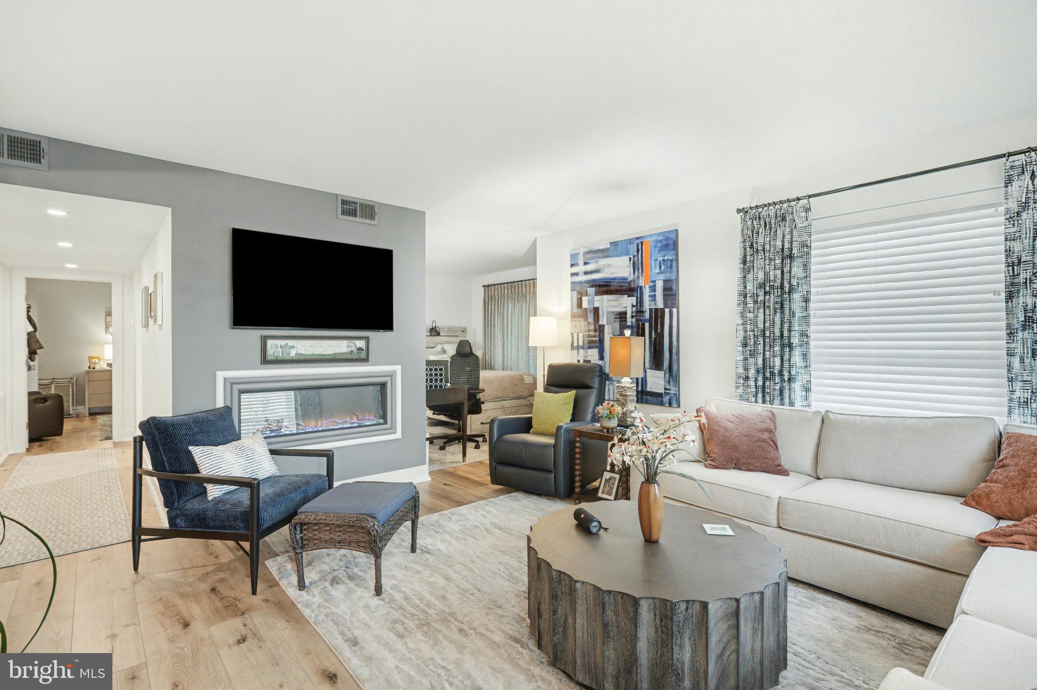 1000 Country Club Road, Unit A13 York, PA 17403 - Photo 2 of 23 a living room with furniture and a flat screen tv