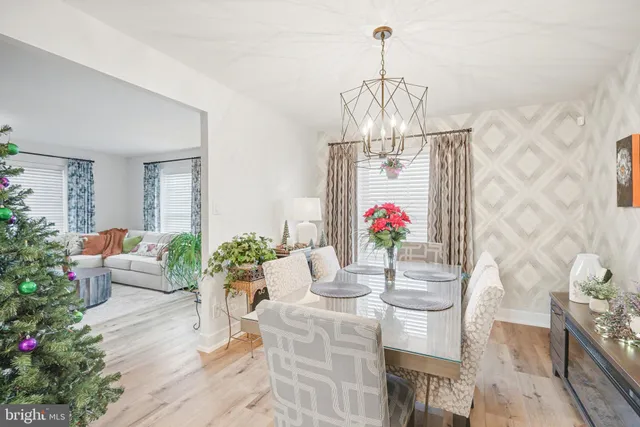 a living room with furniture and flowers