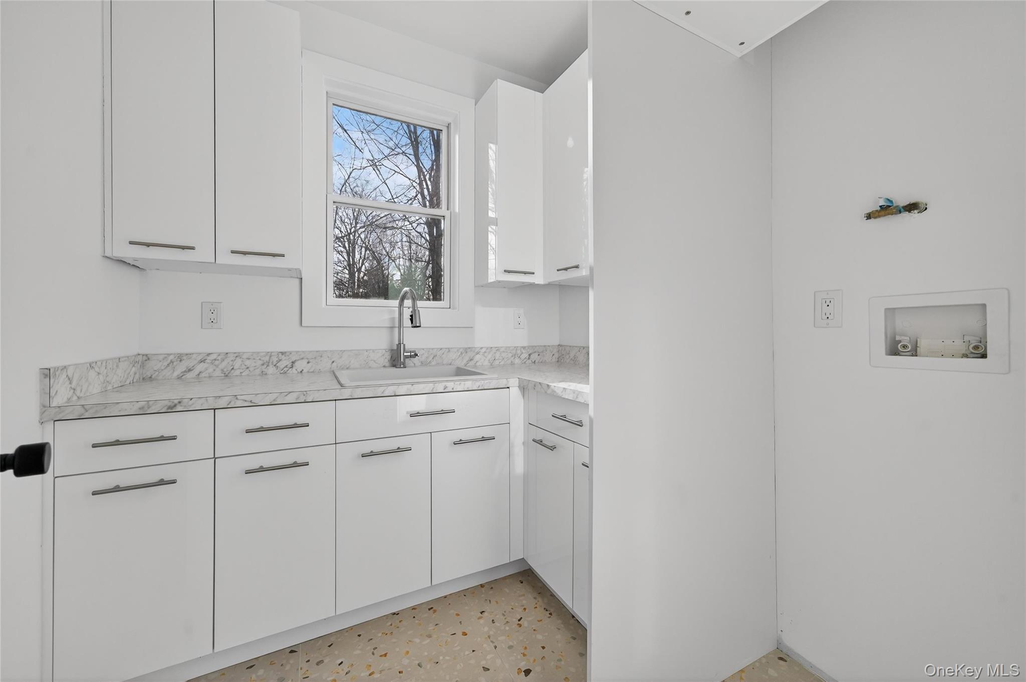 14 East Dillon Road Monticello, NY 12701 - Photo 18 of 50 Laundry area with hookup for a washing machine and cabinet space