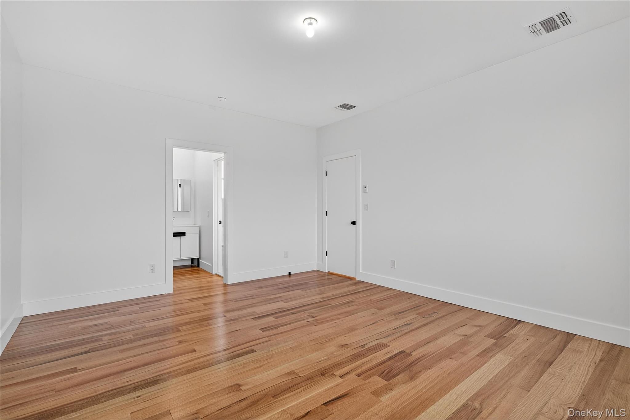 14 East Dillon Road Monticello, NY 12701 - Photo 20 of 50 Unfurnished room with light wood-style floors and baseboards