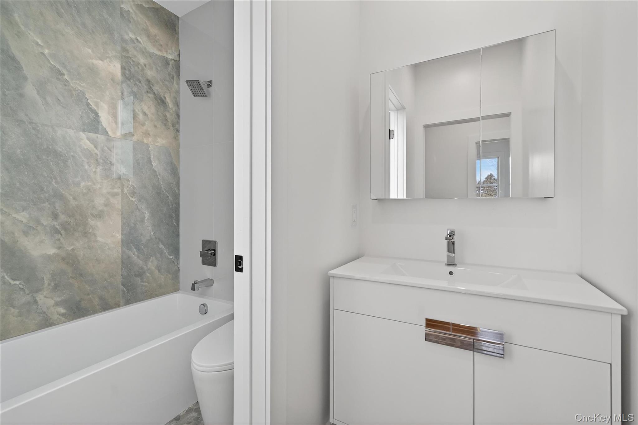 14 East Dillon Road Monticello, NY 12701 - Photo 27 of 50 a bathroom with a sink a toilet and a bathtub