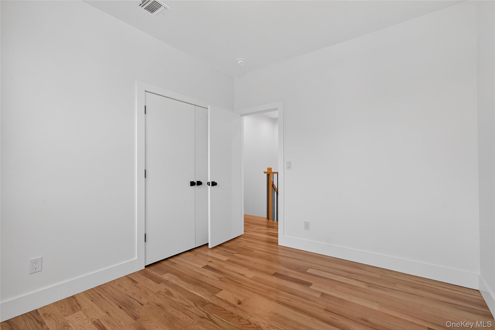 14 East Dillon Road Monticello, NY 12701 - Photo 28 of 50 a view of an empty room with wooden floor