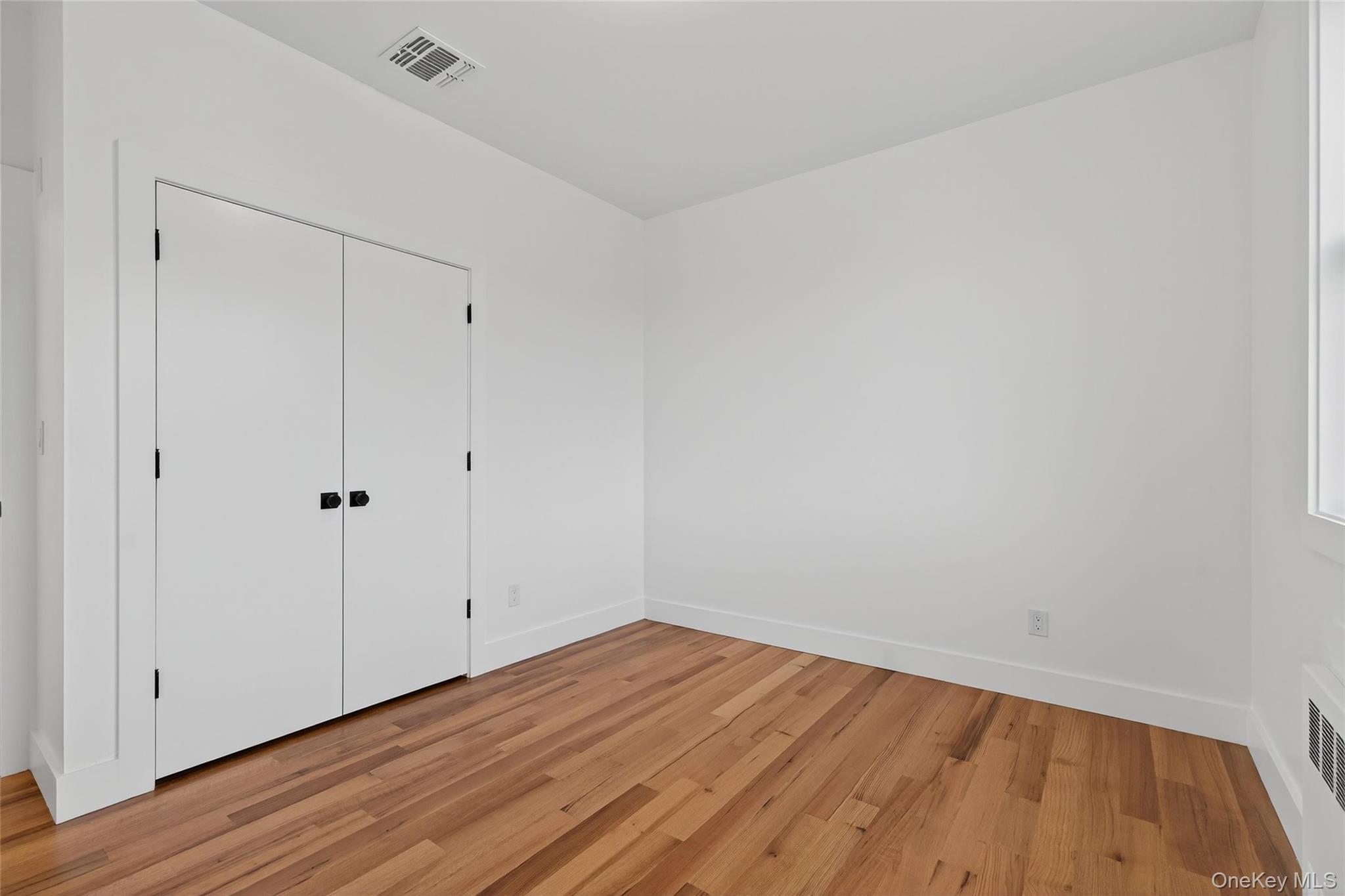 14 East Dillon Road Monticello, NY 12701 - Photo 29 of 50 a view of an empty room with wooden floor