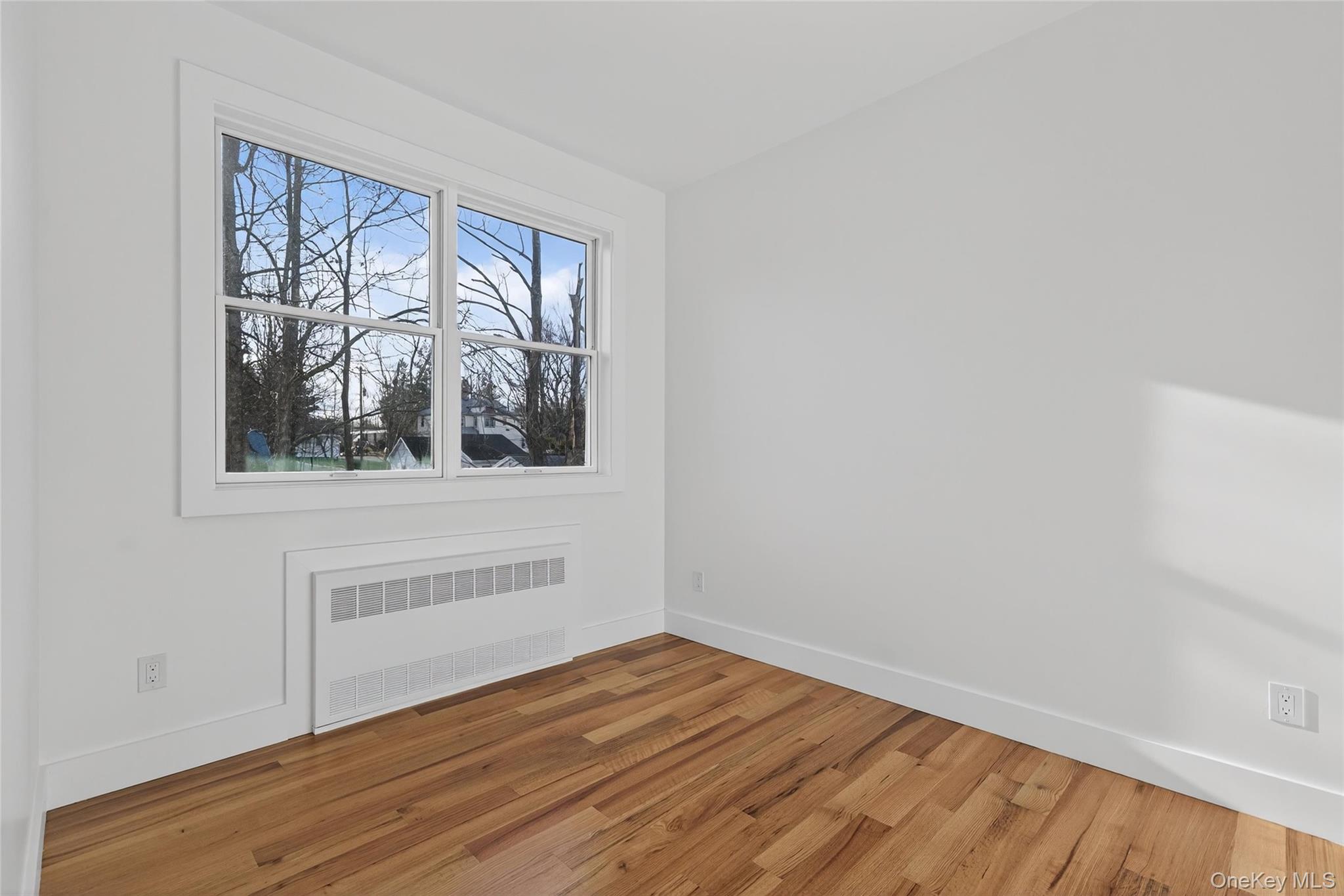 14 East Dillon Road Monticello, NY 12701 - Photo 30 of 50 a view of empty room with wooden floor and fan